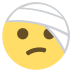 face with head bandage on platform EmojiTwo